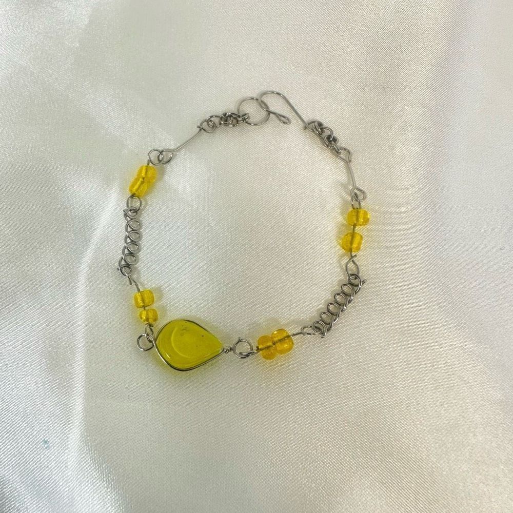 Silver tone and yellow chainโbracelet